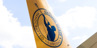 LOT Polish Airlines Boeing 737 MAX 8 with a new paint job for the 100th anniversary of the Krosno brand